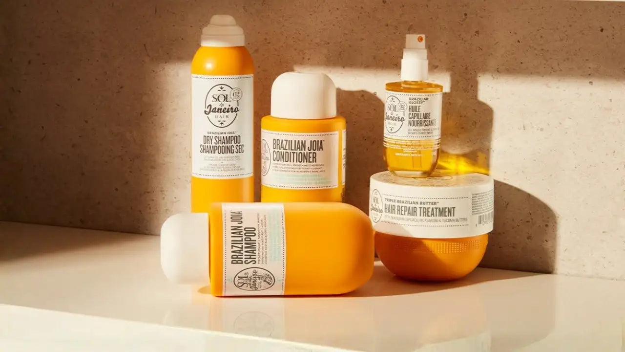 Bouteille orange vibrante de shampoing brésilien Joia avec un bouchon blanc et un design d’étiquette minimaliste.