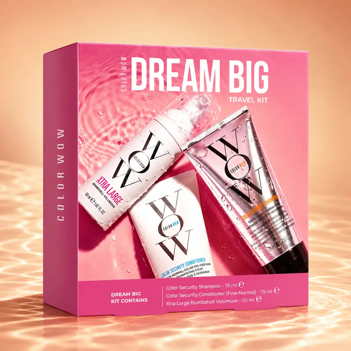 Kit de voyage « Pink ’dream big’ » par Color Wow, contenant un flacon spray blanc, un tube argenté et un tube rose de produits de soin capillaire.